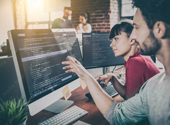 Team of logistics professionals working together to implement transportation ERP solutions in the office