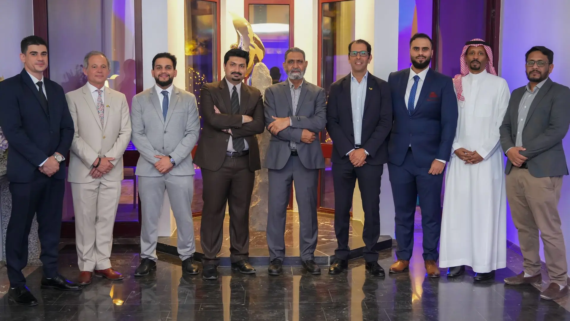 Team photo of Solution Founder professionals at an event, showcasing global offices in Belgium, Tunisia, India, and Morocco