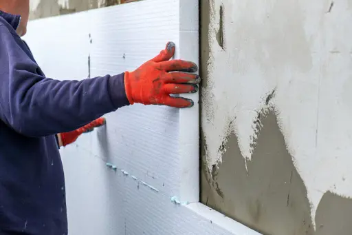 Construction worker applying exterior finishing illustrating high-impact online presence
