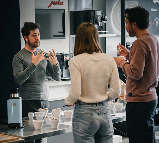 People operating Corica point of sales system at a coffee shop